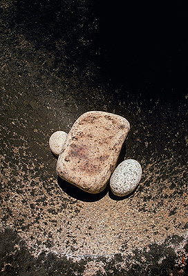 A rock and two more rocks on a rock